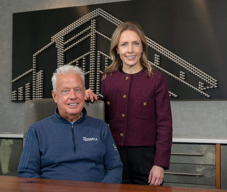Russell Chairman and CEO Jim Russell and President Caitlin Russell pictured in Russell’s Quad Cities office. CREDIT TODD WELVAERT