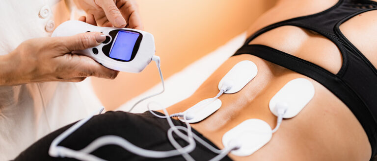 Lower Back Physical Therapy with TENS Electrode Pads, Transcutaneous Electrical Nerve Stimulation. fibromyalgia