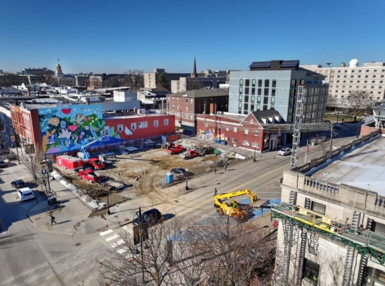 An aerial photo shows the empty lot at 21 S. Linn St.