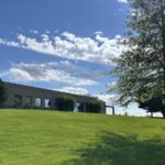 A low-slung building on a hill Morrison Weighing Systems