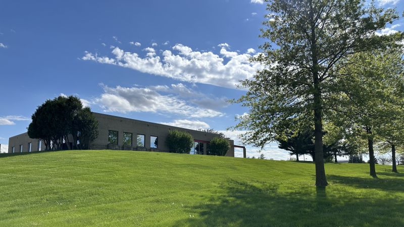 A low-slung building on a hill Morrison Weighing Systems