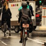 Back view of three commuters on bikes