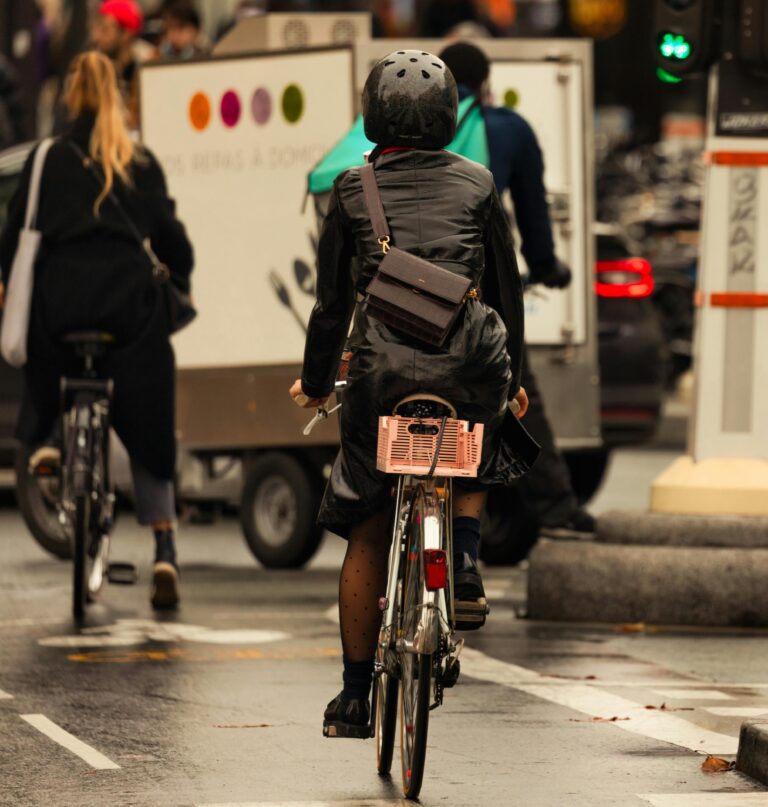Back view of three commuters on bikes