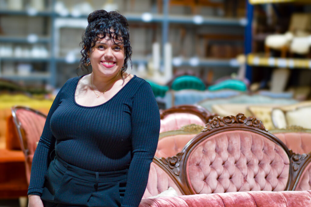 Destiney Benish, owner of Annata Vintage Rental Co., is shown in her warehouse in Palo. CREDIT CINDY HADISH