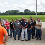 Attendees tour Interstate Swine near Walker, Iowa where Todd and Denise Wiley shared a behind-the-scenes look at modern pork production.